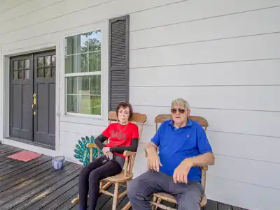 Lewis and Mary Barton on the porch of 17 Oaks Plantation